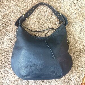 "Fatto a mano by Carlos Falchi" Handmade by Carlos Falchi